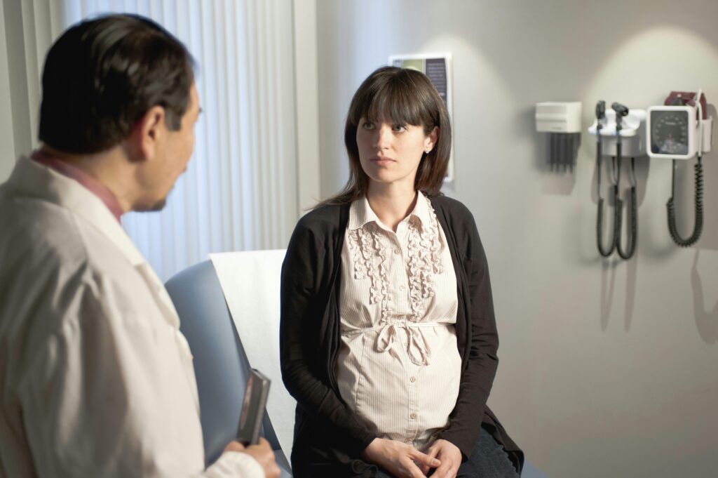 woman and doctor in office discussing fertility treatment