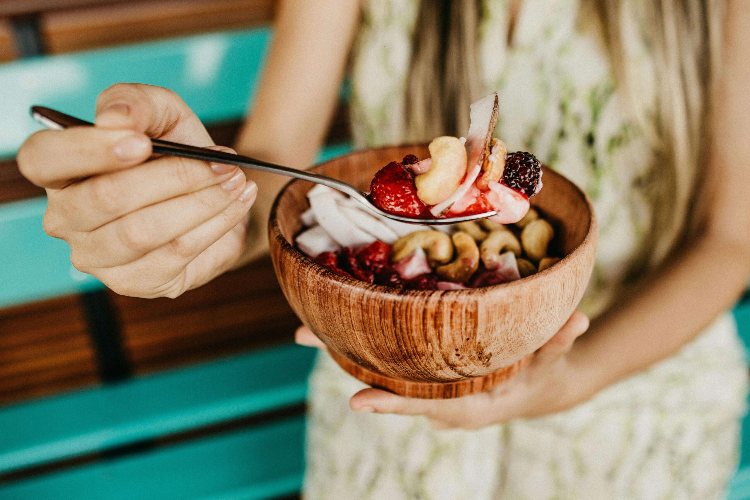 best fertility foods for women, woman eating acai bowl